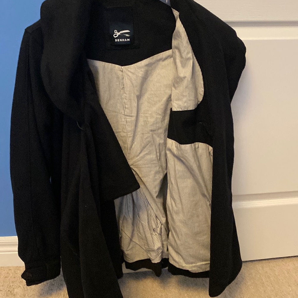 Black midthigh wool coat. Wrap style with built in scarf attached.